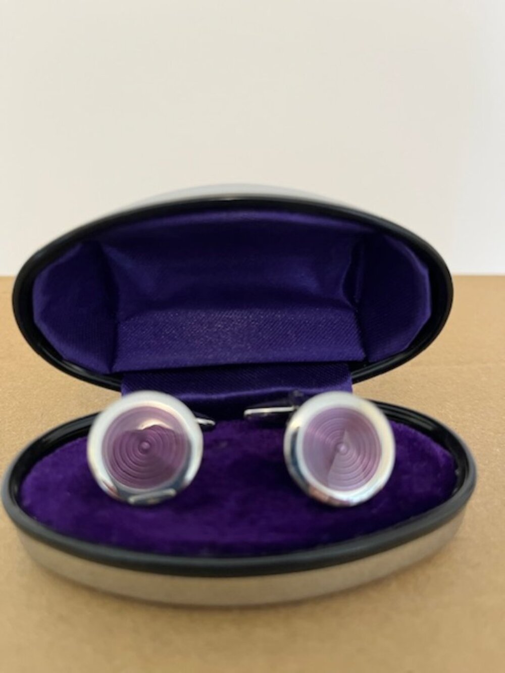 Vintage cuff links in mirrored case.